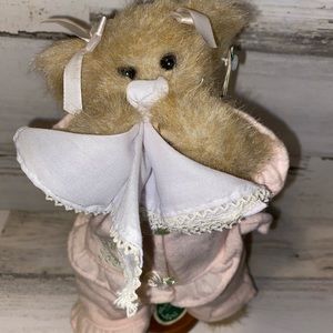 “Get Well Soon” teddy bear in pink pj’s with hanky. Comes with a stand